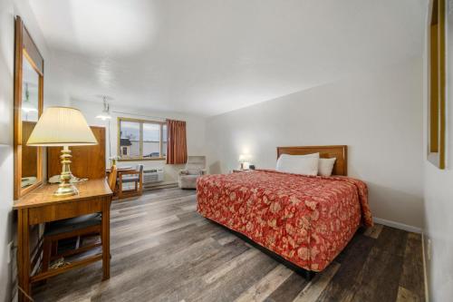 Ένα ή περισσότερα κρεβάτια σε δωμάτιο στο Executive Inn