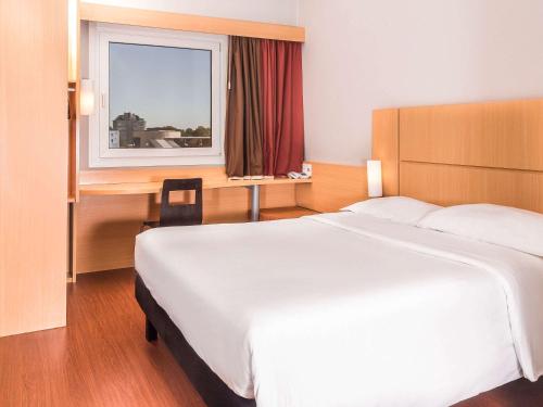 Vuode tai vuoteita majoituspaikassa ibis Asuncion
