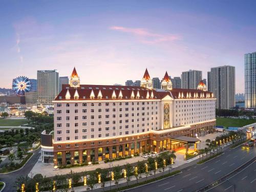 a rendering of a hotel with a city in the background at Swissôtel Hefei Grand Park in Hefei