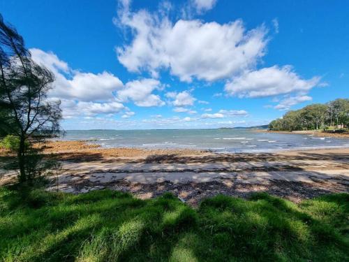 a view of the ocean from a beach at Sojourn at the Cove - opposite Heros Beach in North Arm Cove