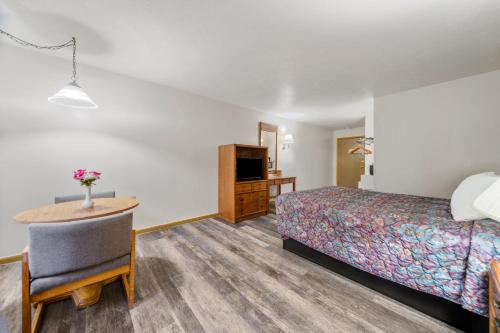 Ένα ή περισσότερα κρεβάτια σε δωμάτιο στο Executive Inn