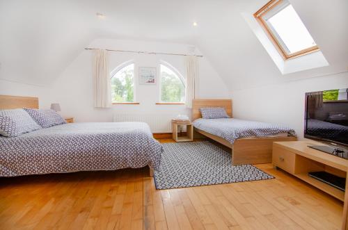 Postel nebo postele na pokoji v ubytování Rathmullan Cottages No.3 - free wifi, pet friendly