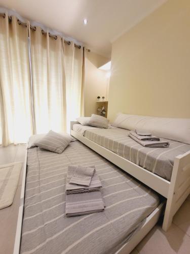 Giường trong phòng chung tại Casa Marcelino Refugio Frente Mar