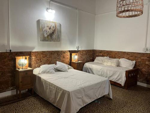 Giường trong phòng chung tại La Blanquita de Areco