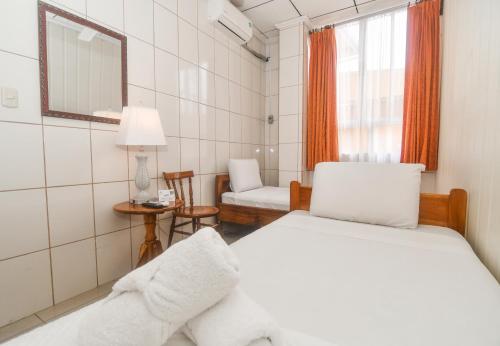 Ένα ή περισσότερα κρεβάτια σε δωμάτιο στο Hotel Aldea Chorotega Puntarenas