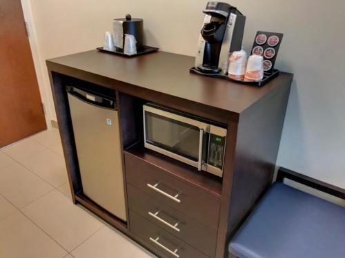 a counter with a microwave on top of it at Comfort Inn & Suites in Terrace
