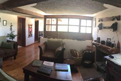 a living room with a couch and a table at Charming house in Zuleta Mariano and Pastora in Zuleta