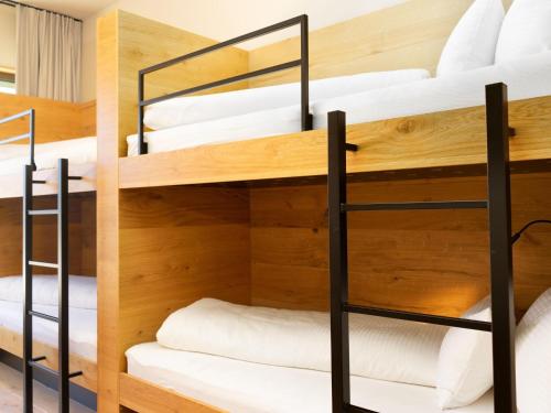 a bedroom with bunk beds in a hostel at Apartment in Schröcken near Ski Arlberg in Schröcken