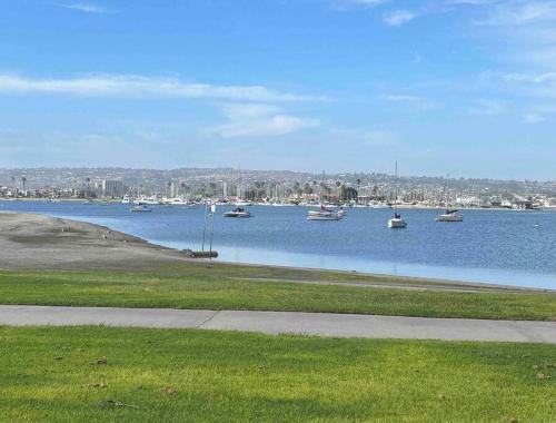 a large body of water with boats in it at Location, location, location! 10 steps to the beach in San Diego