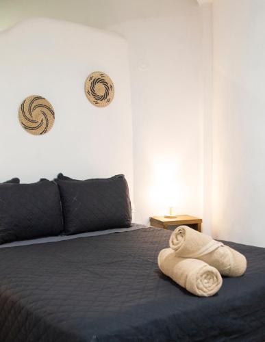 Ένα ή περισσότερα κρεβάτια σε δωμάτιο στο Sonido del mar Hotel Boutique & Yoga Loft