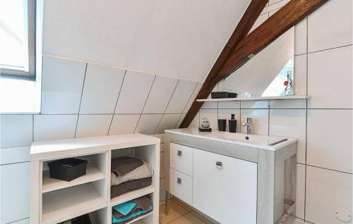 a white bathroom with a sink and a counter at Amazing Apartment In Rouffach With 2 Bedrooms And Wifi in Rouffach