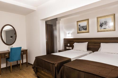 Posteľ alebo postele v izbe v ubytovaní Slimiza Suites