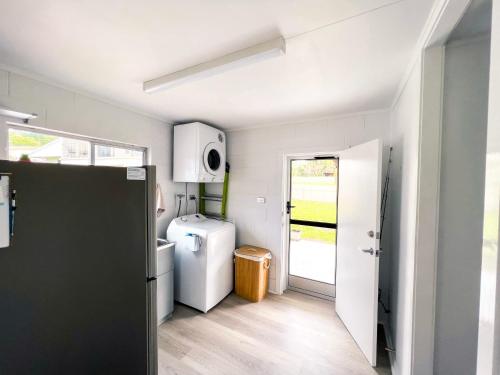 Η κουζίνα ή μικρή κουζίνα στο Bella Luna Beach Front - 3 bed
