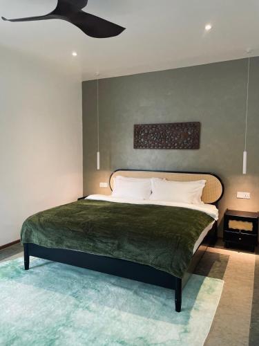 En eller flere senge i et værelse på Attitude Resort Langkawi