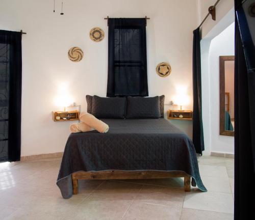 Ένα ή περισσότερα κρεβάτια σε δωμάτιο στο Sonido del mar Hotel Boutique & Yoga Loft