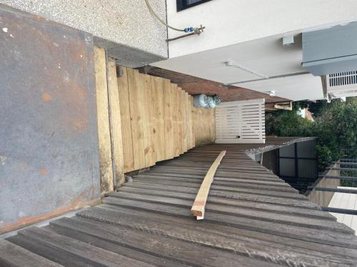 a wooden ramp leading up to a building at Little Molly - Private Guest Suite in Mollymook