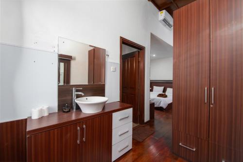 a bathroom with a sink and a mirror at Villa Taurus in Seminyak