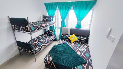 a room with three bunk beds and a window at 3A YOLO Budget Condo in Kuala Lumpur