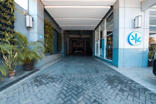 an empty hallway of a building with plants at Hotel Pier Cuatro in Cebu City