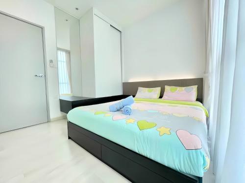 a bedroom with a bed with hearts on it at Straits Garden Suites Penang in Jelutong