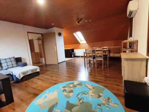 a living room with a map rug on a wooden floor at XLSuite Apartment Superior in Piešťany