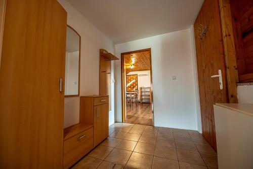 a kitchen with a door leading to a dining room at XLSuite Apartment Superior in Piešťany