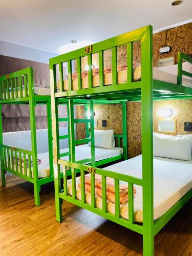 a group of bunk beds in a room at Frutta Hostel in Patong Beach