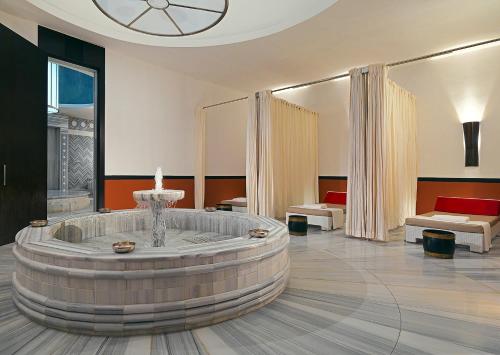 a room with a large tub in the middle of a room at Sheraton Batumi Hotel in Batumi