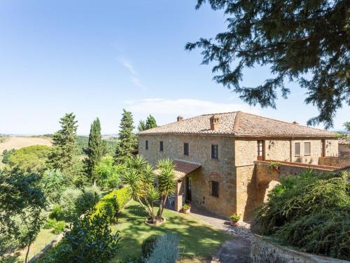 an external view of a villa with a garden at Lavish Holiday Home in Volterra with Pool in Volterra