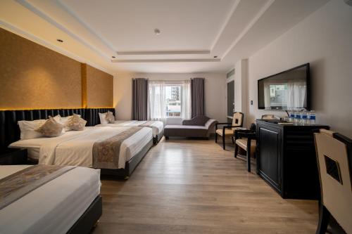 Postel nebo postele na pokoji v ubytování Rosaleen Boutique Hotel