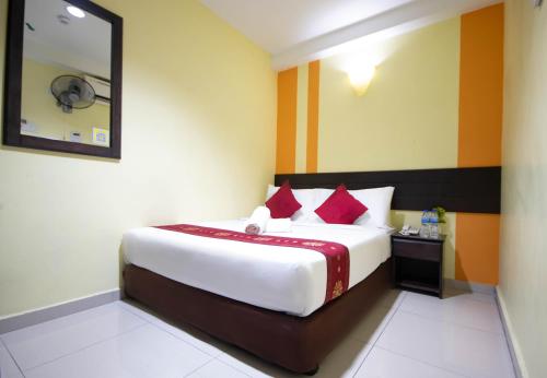 Ένα ή περισσότερα κρεβάτια σε δωμάτιο στο Sun Inns Hotel Sentral, Brickfields