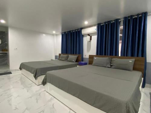 Llit o llits en una habitació de Cat Ba Santorini Homestay