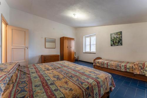 En eller flere senge i et værelse på Orbetello Giannella Apartment