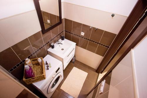 a small bathroom with a toilet and a sink at Apartmán RADKA in Zvolen