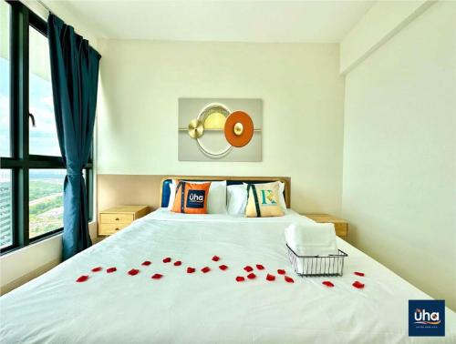 a bedroom with a bed with red roses on it at Macrolink Medini by RR JBcity in Nusajaya