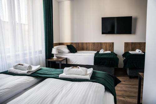 Katil atau katil-katil dalam bilik di Apartamenty W Centrum Chrzanowa