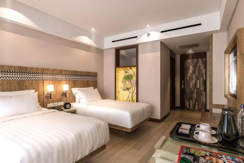 Ένα ή περισσότερα κρεβάτια σε δωμάτιο στο Fairfield by Marriott Bali Legian
