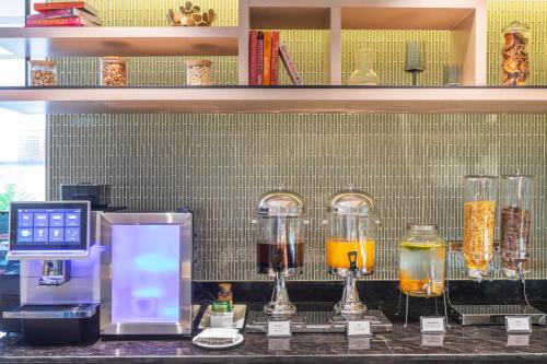 a counter with three different types of drinks in blenders at Best Western Click Sathorn 11 Bangkok in Bangkok