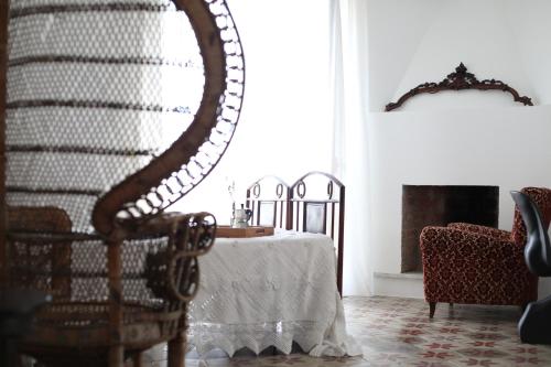 a dining room with a table and a chair at Casa Aulivo in Caiazzo