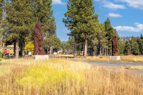two statues of bears standing in a field at Centrally Located and Dog Friendly! - Home #36 in Bear Valley