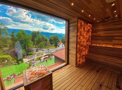 a large window in a room with a view at Apartman Milanovic in Pribojska Banja