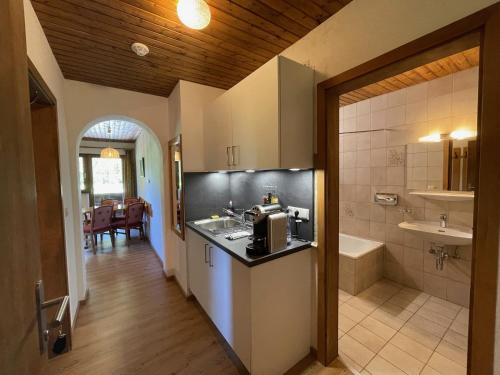 a kitchen with a sink and a counter top at Garni Bärenwirt in Leutasch