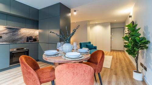 a dining room with a table and chairs at RUAH Apartments by LovelyStay in Vila Nova de Gaia