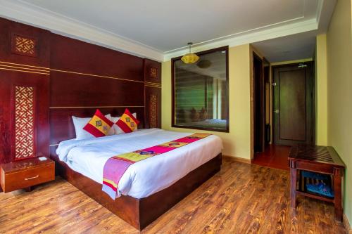 Ένα ή περισσότερα κρεβάτια σε δωμάτιο στο Sapa Vista Hotel
