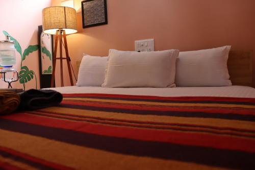 Ένα ή περισσότερα κρεβάτια σε δωμάτιο στο Da Mantra House