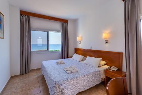 Postel nebo postele na pokoji v ubytování TETYK Hotel