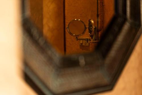 a mirror with a reflection of a door with a handle at Ras Sedr Royal Beach Villa at Sinaway Lagoon Hotel & Spa- Ras Sedr, Egypt in Ras Sedr