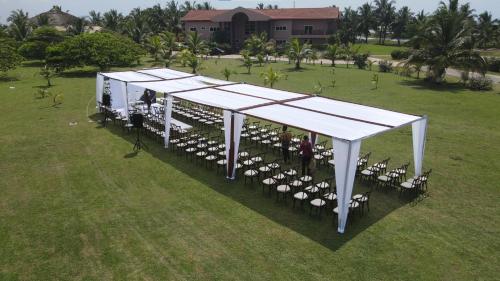 an overhead view of a tent with a bunch of chairs at Bojo Beach Resort in Bortianor