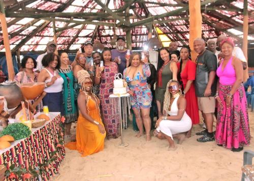 a group of people posing for a picture at a party at Bojo Beach Resort in Bortianor