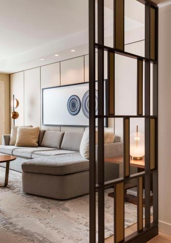 a living room with a couch and a table at Park Hyatt Chicago in Chicago